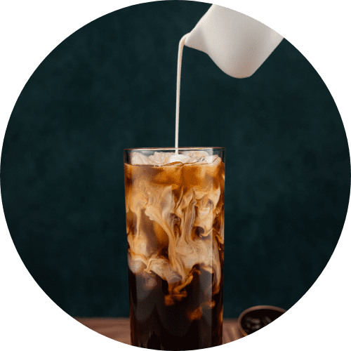 milk pouting on iced coffee